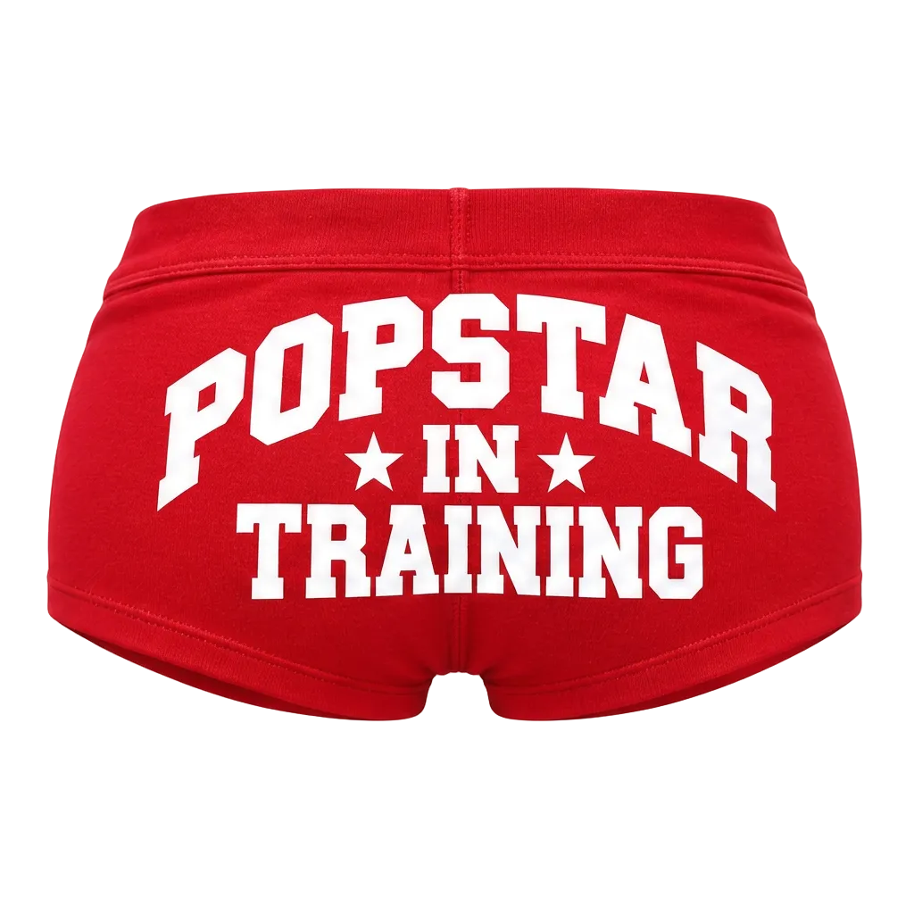 Red shorts with white POPSTAR IN TRAINING lettering, back view