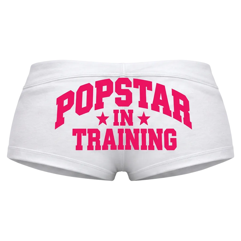 White shorts with pink lettering, back view