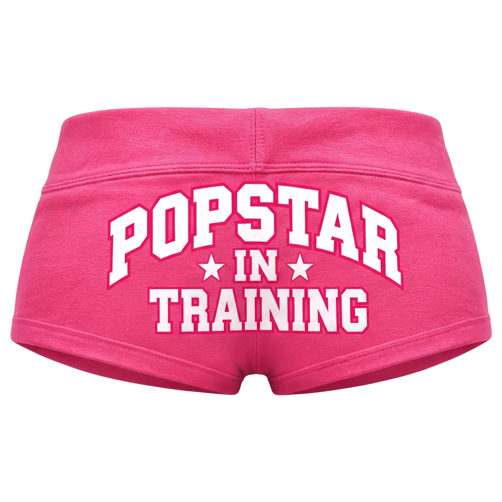 Pink shorts with white lettering, back view